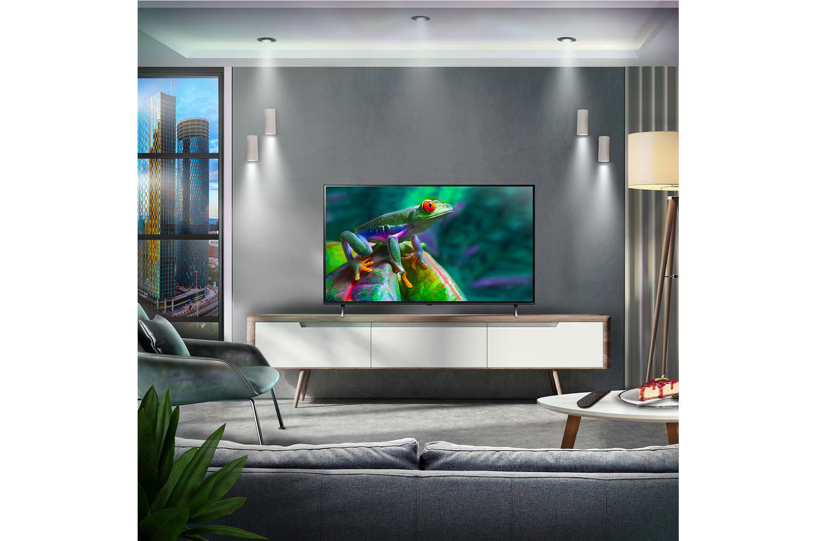 Modern living room with a television displaying a colorful frog on a gray wall.